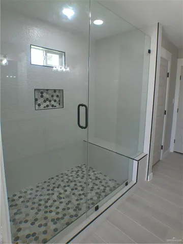 a bathroom with a double vanity sink and mirror