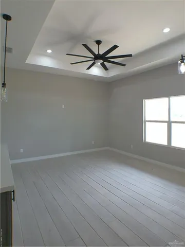 a view of a kitchen sink and a chandelier fan
