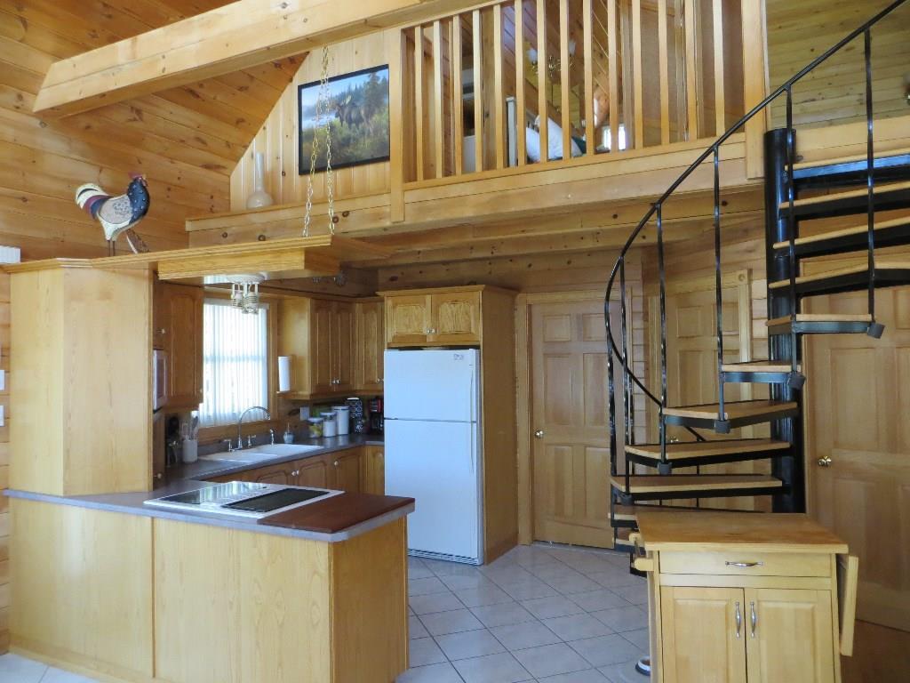 1621 Sly Brook Road Eagle Lake, ME 04739 - Photo 8 of 35 Custom brown ash cabinetry with ash...