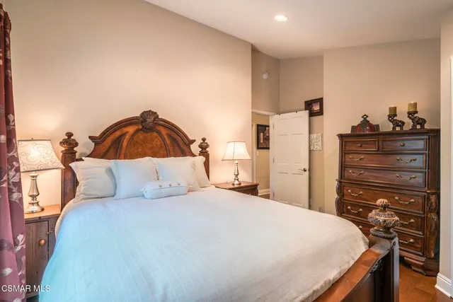 a bathroom with a granite countertop sink toilet and a mirror