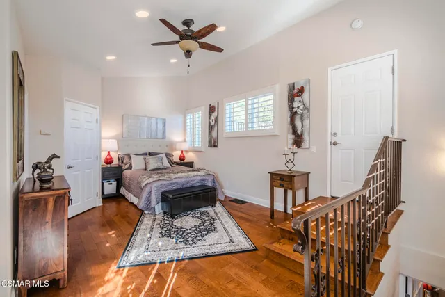 a view of an empty room with fireplace and a window