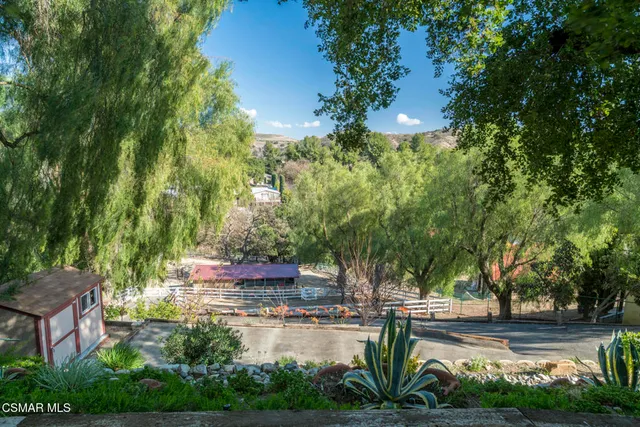 a view of backyard with sitting area