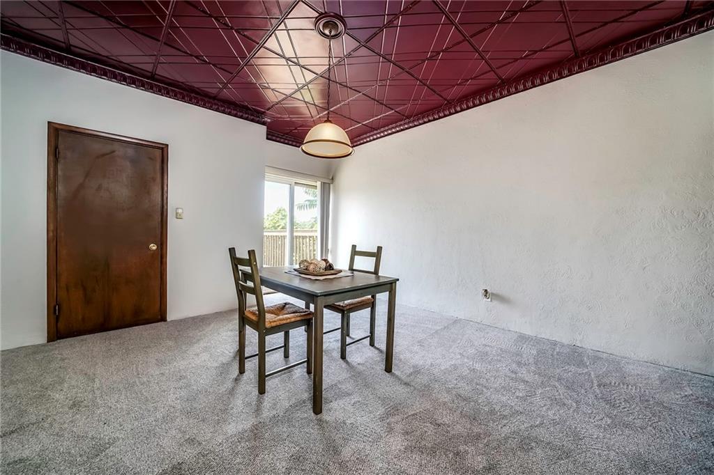 805 Frank Street McKees Rocks, PA 15136 - Photo 12 of 25 a dining room with a wooden table and chairs