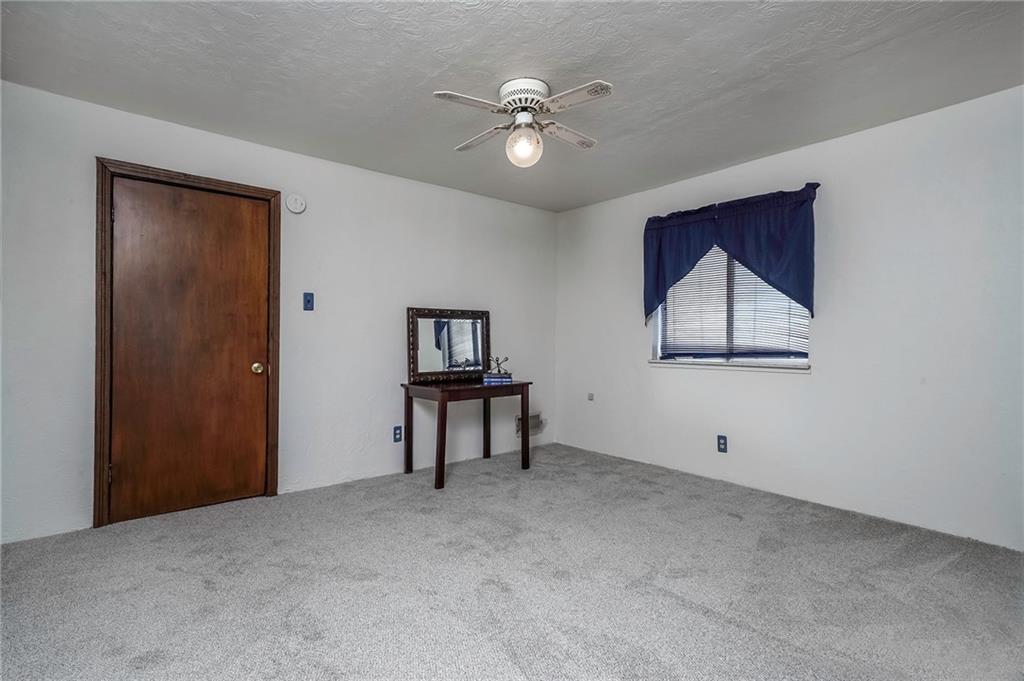 805 Frank Street McKees Rocks, PA 15136 - Photo 18 of 25 a view of an empty room with window and a kitchen