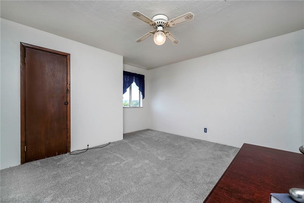 805 Frank Street McKees Rocks, PA 15136 - Photo 19 of 25 an empty room with windows and fan