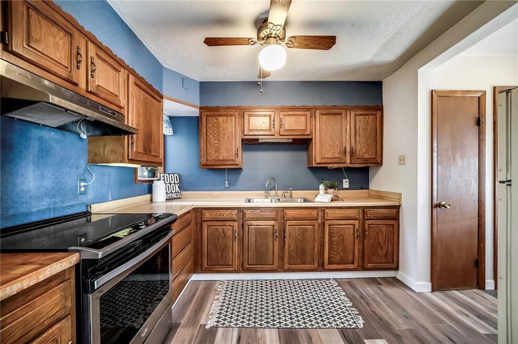 805 Frank Street McKees Rocks, PA 15136 - Photo 6 of 25 a kitchen with a sink appliances and cabinets