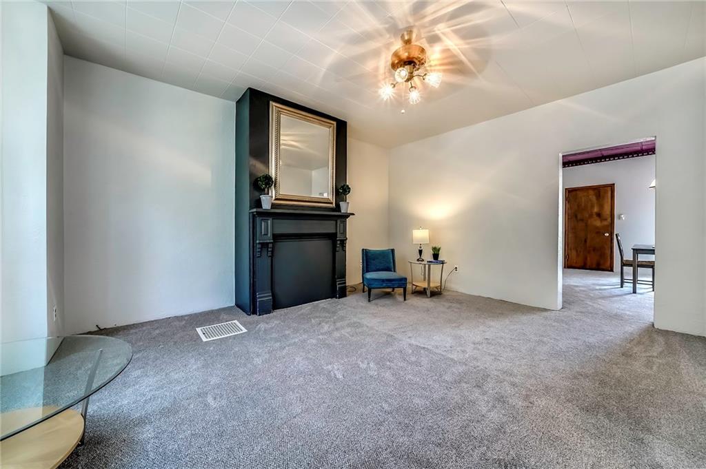 805 Frank Street McKees Rocks, PA 15136 - Photo 8 of 25 a view of livingroom with furniture and chandelier fan