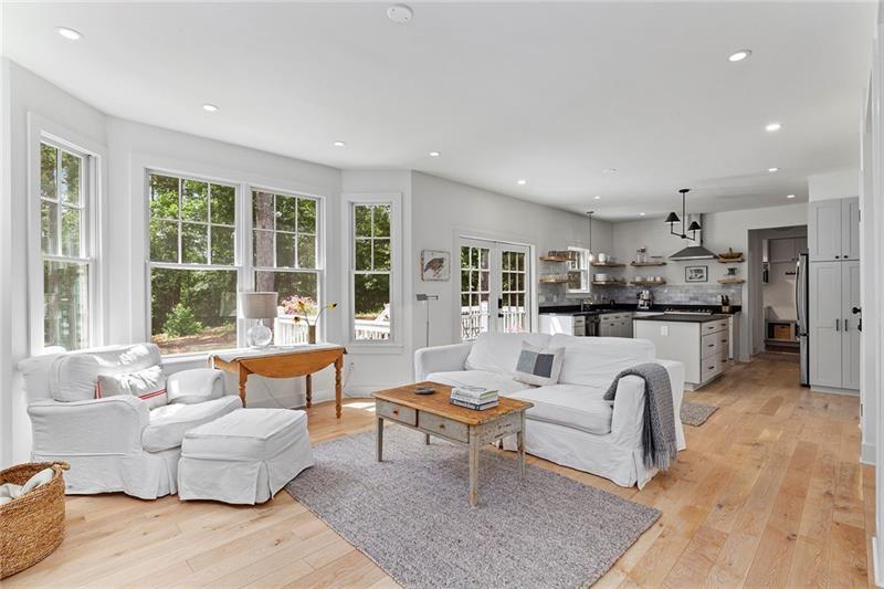 7600 Barnes Road Palmetto, GA 30268 - Photo 11 of 37 a living room with fireplace furniture and floor to ceiling windows