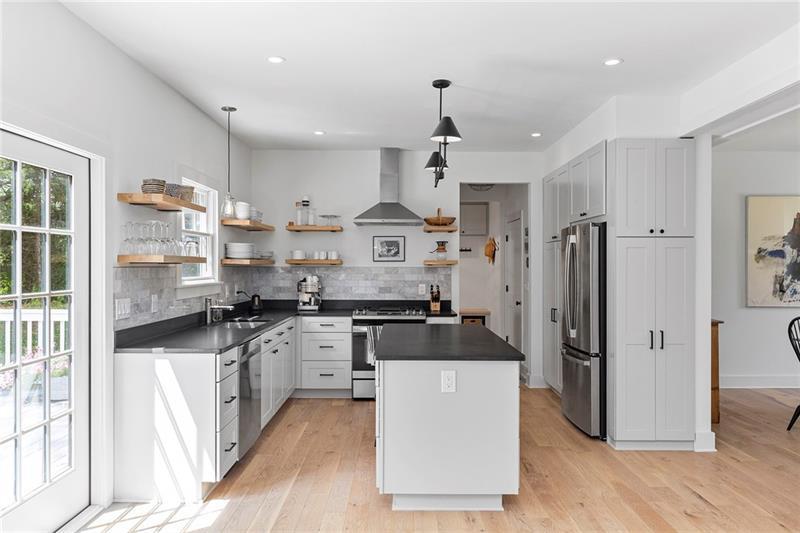 7600 Barnes Road Palmetto, GA 30268 - Photo 12 of 37 a large kitchen with stainless steel appliances granite countertop a stove and a refrigerator