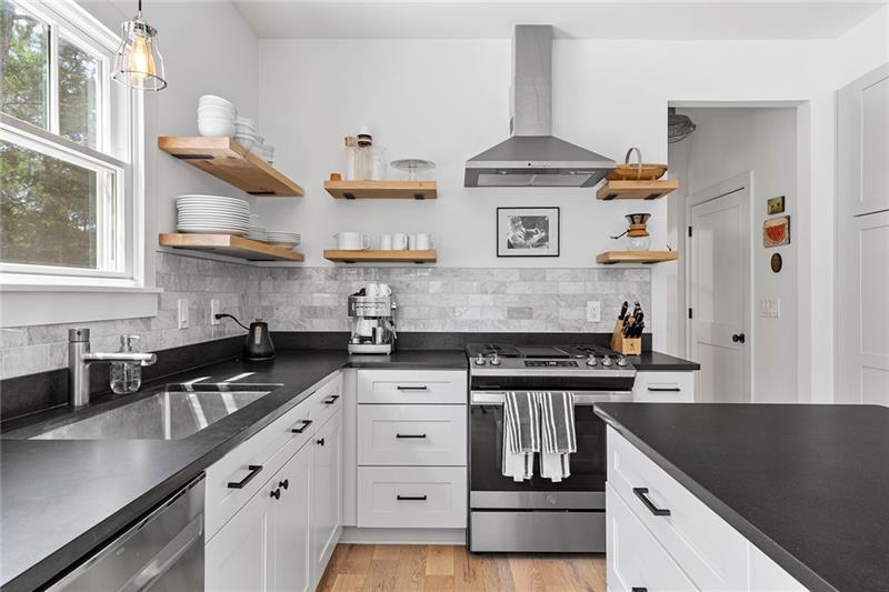 7600 Barnes Road Palmetto, GA 30268 - Photo 13 of 37 a kitchen with stainless steel appliances granite countertop a stove and a sink