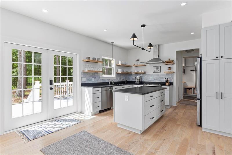 7600 Barnes Road Palmetto, GA 30268 - Photo 16 of 37 a kitchen with stainless steel appliances granite countertop a stove a refrigerator and a cabinets