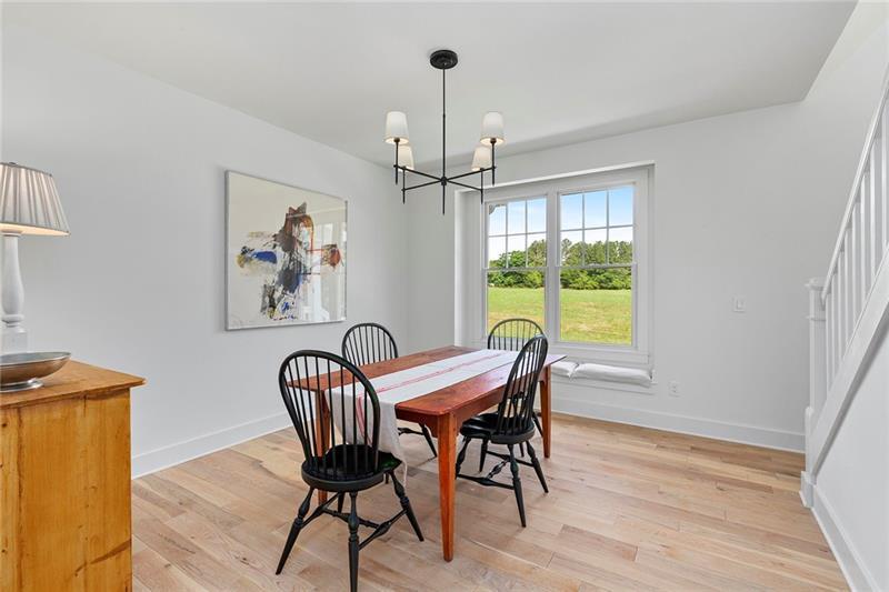 7600 Barnes Road Palmetto, GA 30268 - Photo 18 of 37 a view of a dining room with furniture window and wooden floor
