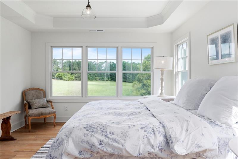 7600 Barnes Road Palmetto, GA 30268 - Photo 25 of 37 a bedroom with a bed and a chair