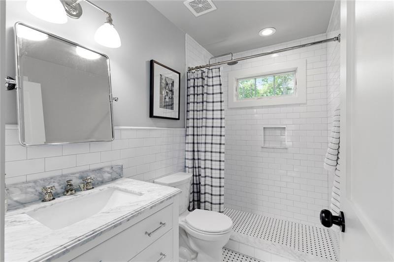 7600 Barnes Road Palmetto, GA 30268 - Photo 31 of 37 a bathroom with a sink toilet vanity and shower