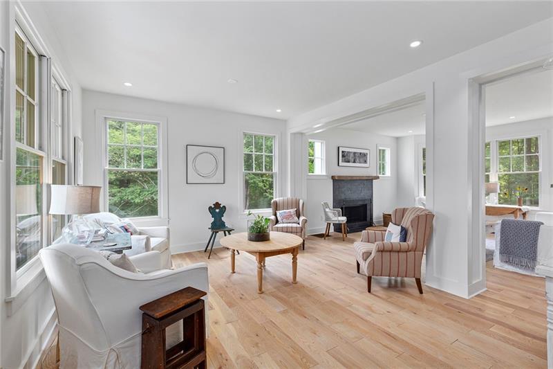 7600 Barnes Road Palmetto, GA 30268 - Photo 7 of 37 a living room with fireplace furniture and a large window