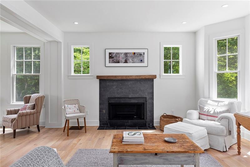 7600 Barnes Road Palmetto, GA 30268 - Photo 10 of 37 a living room with furniture and a fireplace