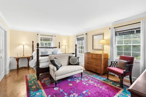 a living room with furniture and a rug