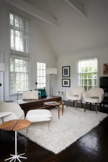 a living room with furniture and a table
