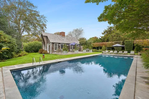 a view of a lake with a house swimming pool and outdoor space