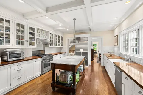 a kitchen with stainless steel appliances granite countertop a stove and cabinets