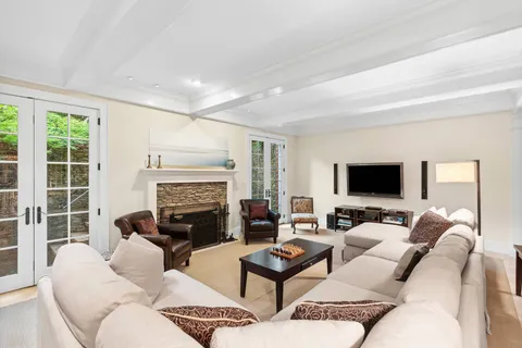 a living room with furniture fireplace and a flat screen tv