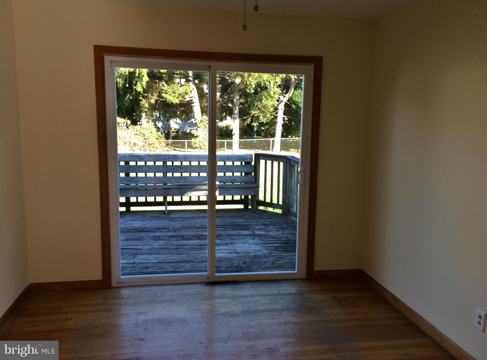 2115 Gaybrook Road Baltimore, MD 21244 - Photo 5 of 10 a view of front door and deck in the house