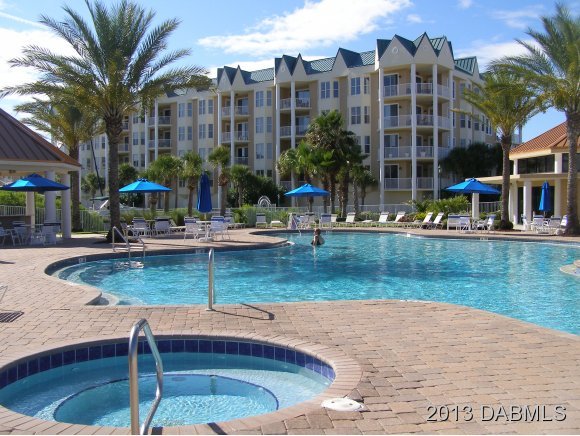 4623 Rivers Edge Village Lane, Unit 6208 Ponce Inlet, FL 32127 - Photo 15 of 23 a view of a swimming pool with a house