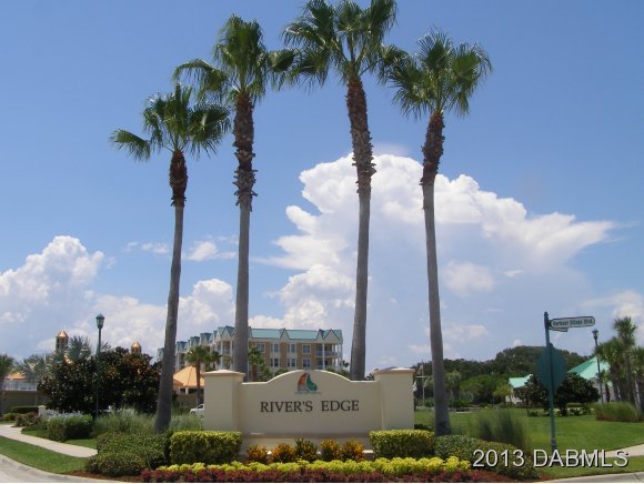4623 Rivers Edge Village Lane, Unit 6208 Ponce Inlet, FL 32127 - Photo 16 of 23 a view of a city with palm trees