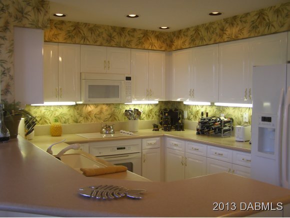4623 Rivers Edge Village Lane, Unit 6208 Ponce Inlet, FL 32127 - Photo 2 of 23 a bathroom with a sink and mirror