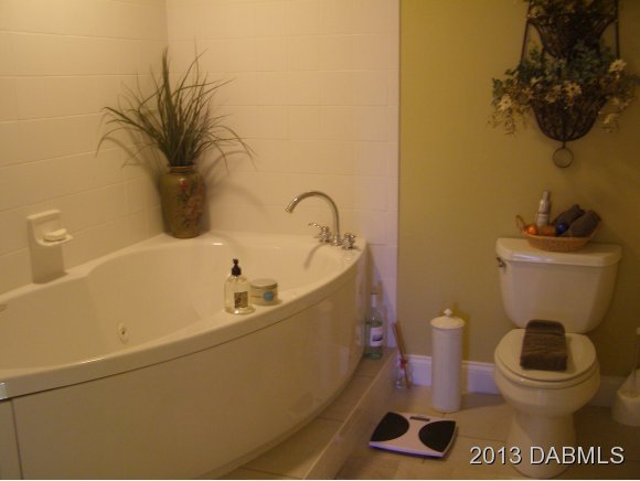 4623 Rivers Edge Village Lane, Unit 6208 Ponce Inlet, FL 32127 - Photo 22 of 23 a bathroom with a sink and a toilet