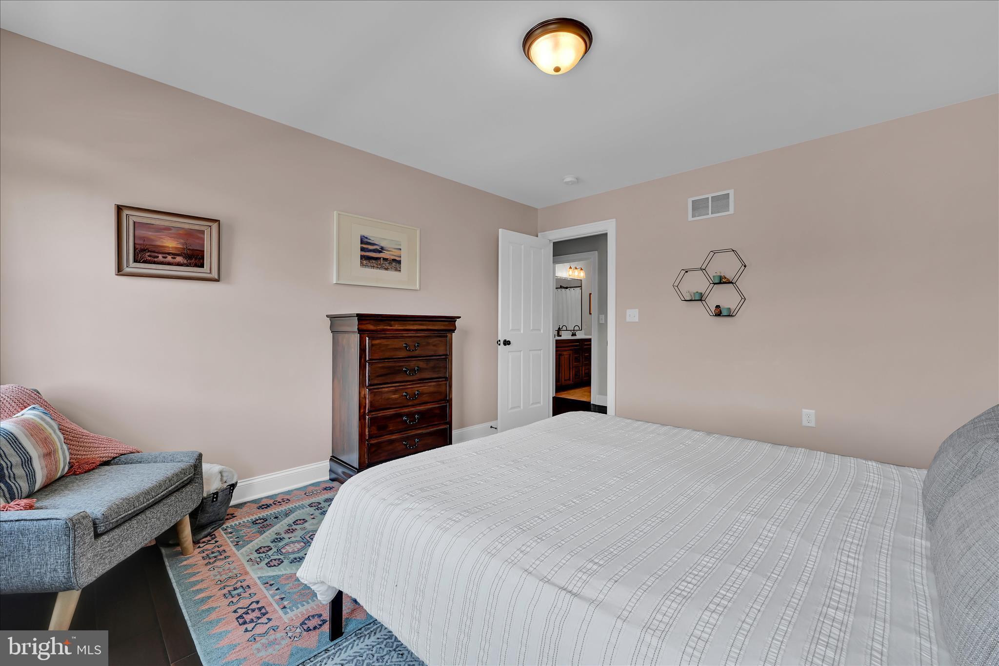 678 Integrity Drive Lititz, PA 17543 - Photo 29 of 51 a bedroom with a bed and a couch