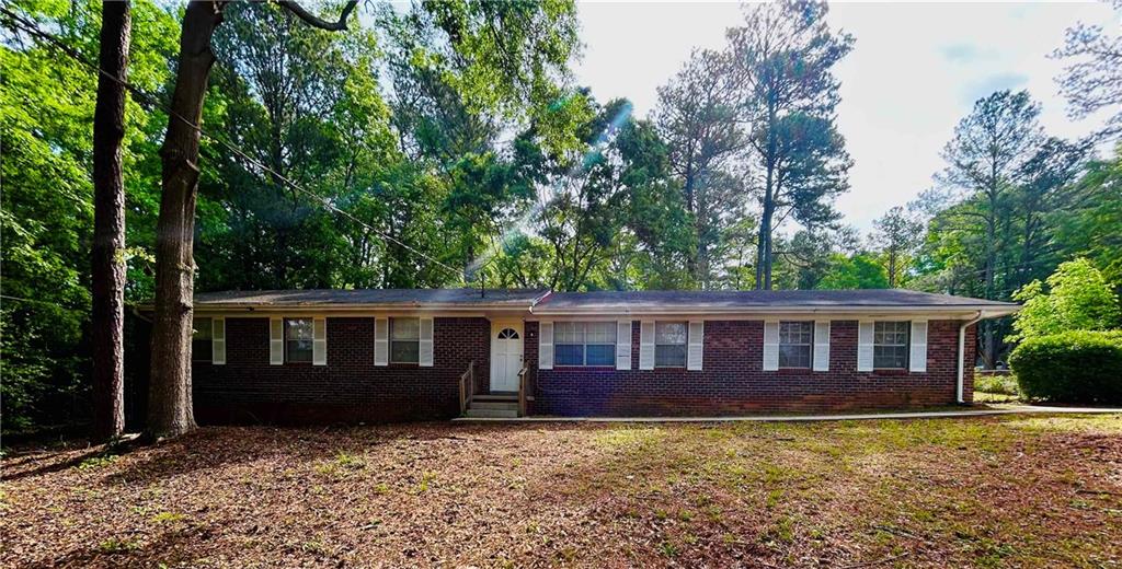 2180 Blue Creek Court Conley, GA 30288 - Photo 1 of 1 a view of a house with backyard and sitting area