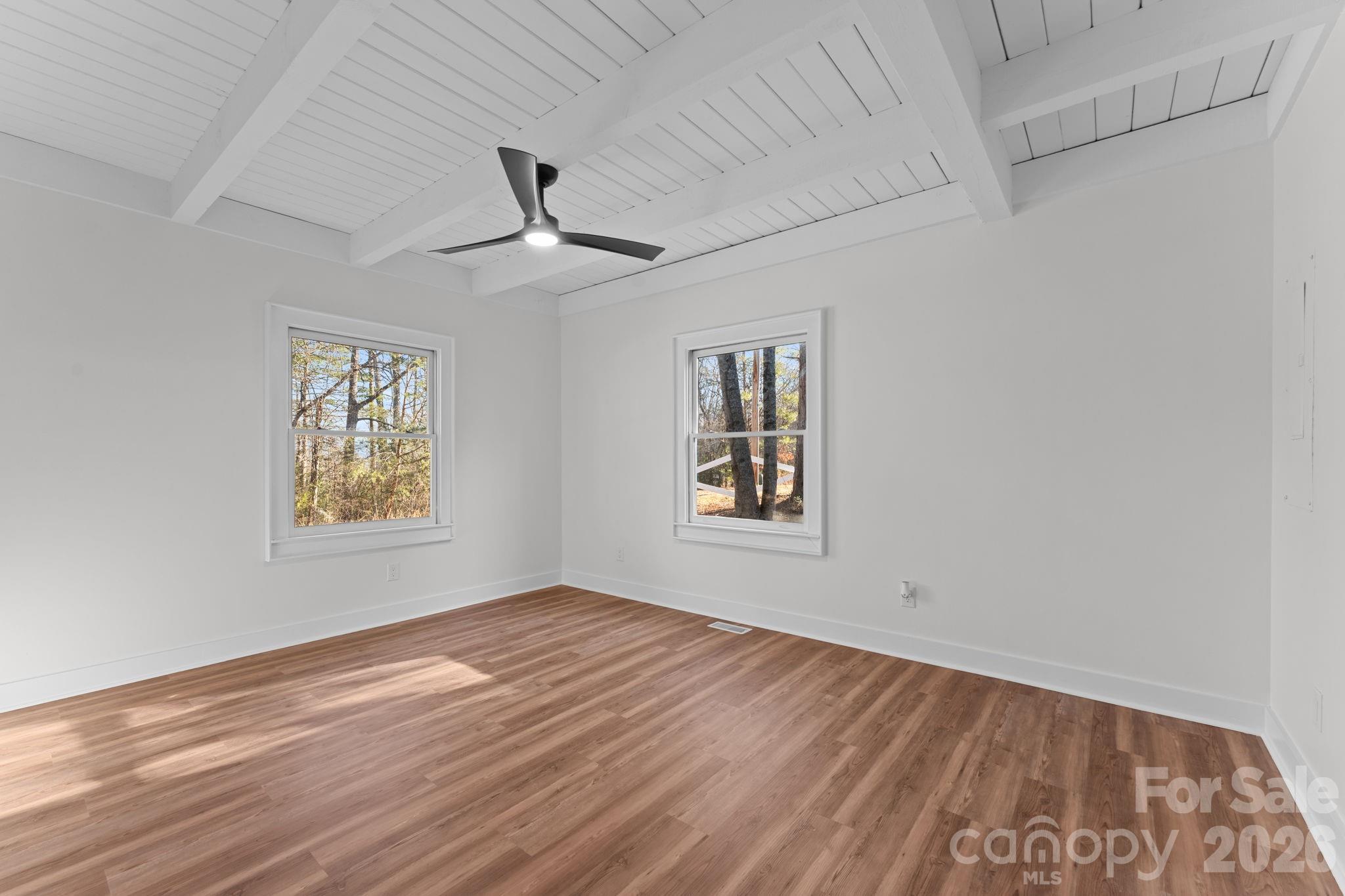 15 Glory Road Franklin, NC 28734 - Photo 11 of 37 a view of empty room with wooden floor and fan