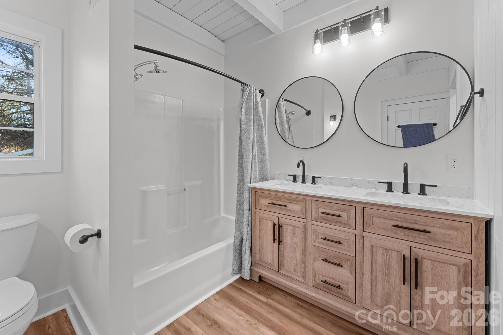 15 Glory Road Franklin, NC 28734 - Photo 12 of 37 a spacious bathroom with a granite countertop sink mirror and bathtub