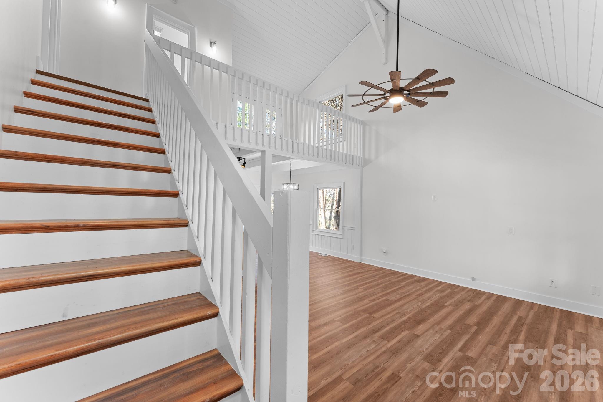15 Glory Road Franklin, NC 28734 - Photo 14 of 37 a view of a hallway with wooden floor and staircase