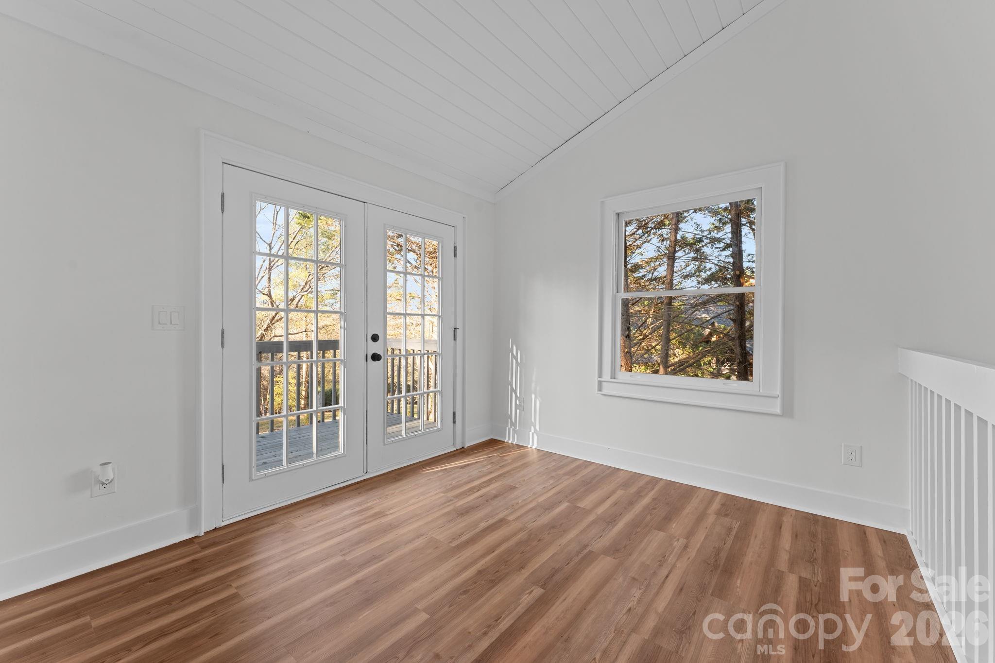 15 Glory Road Franklin, NC 28734 - Photo 18 of 37 an empty room with wooden floor and windows