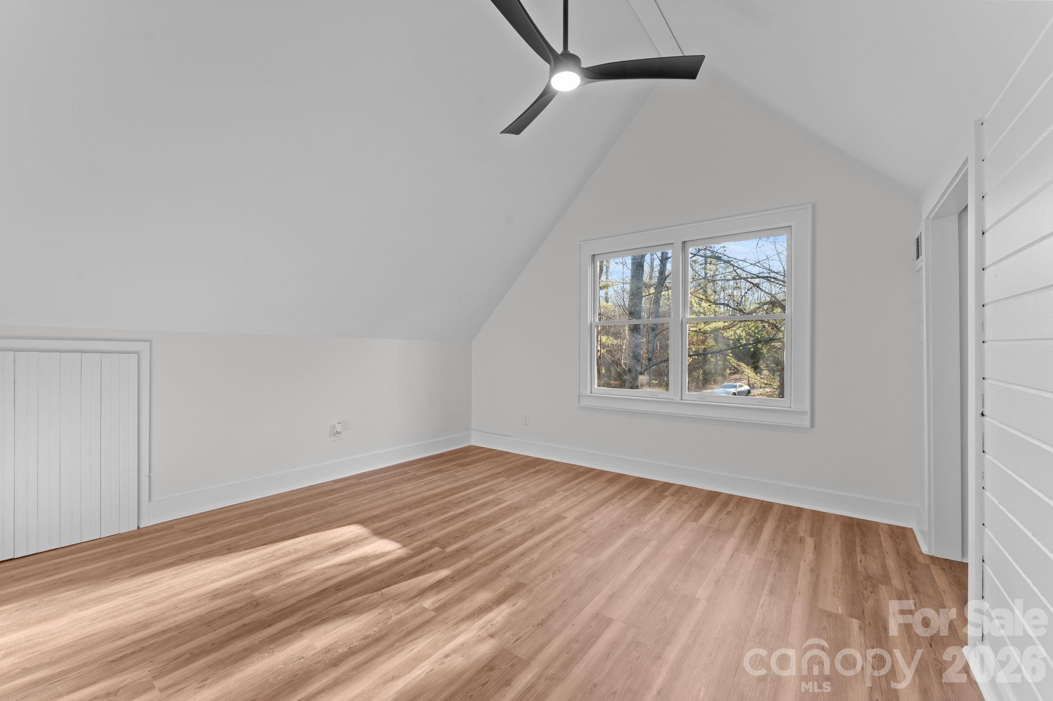 15 Glory Road Franklin, NC 28734 - Photo 21 of 37 wooden floor in an empty room with a window