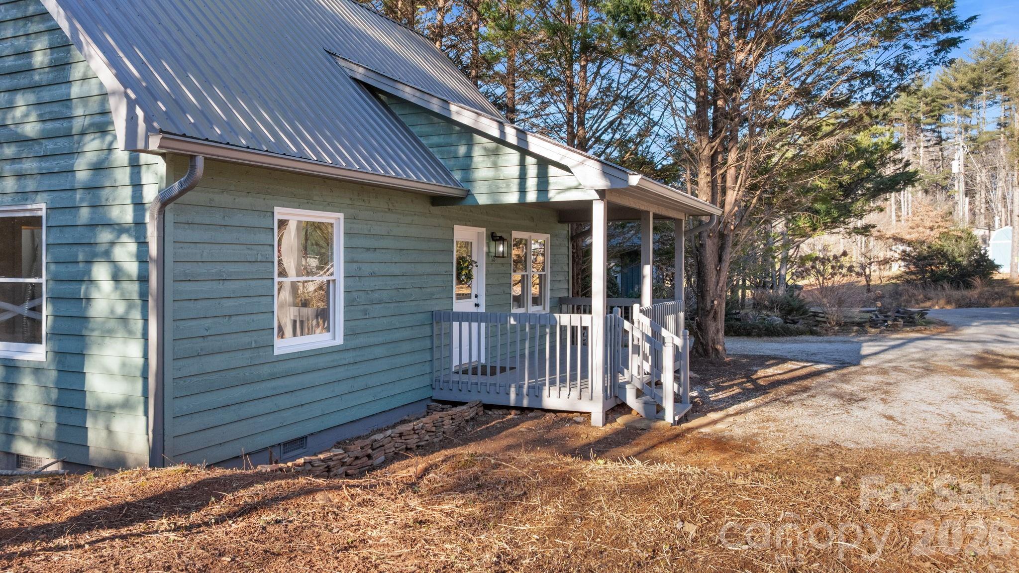 15 Glory Road Franklin, NC 28734 - Photo 30 of 37 a view of a house with a small yard and large tree