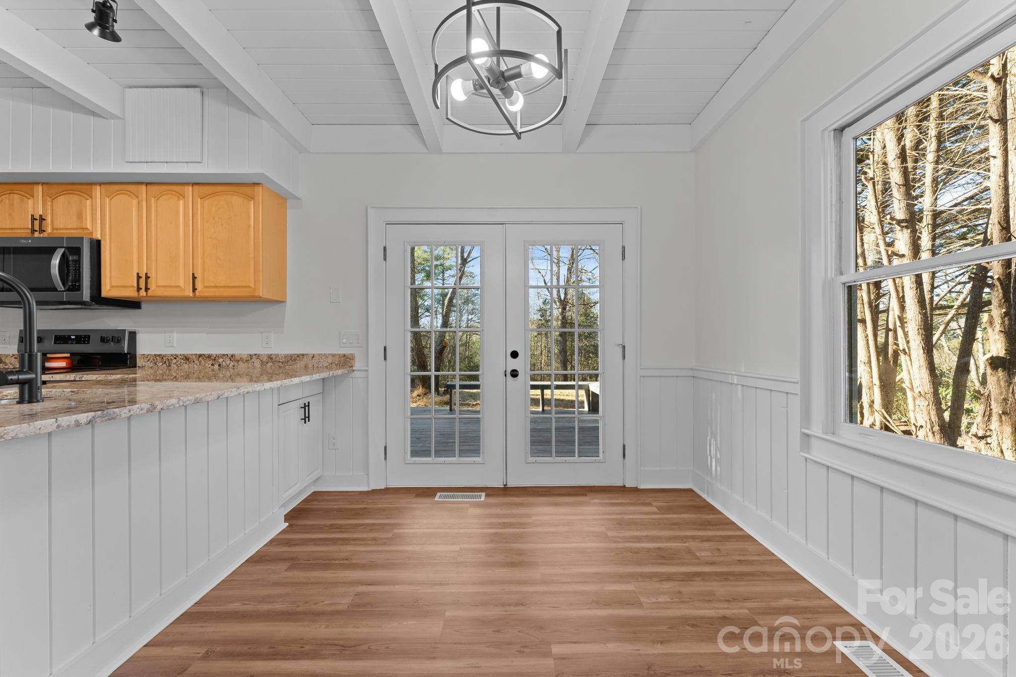 15 Glory Road Franklin, NC 28734 - Photo 3 of 37 a view of a kitchen with wooden floor and a window