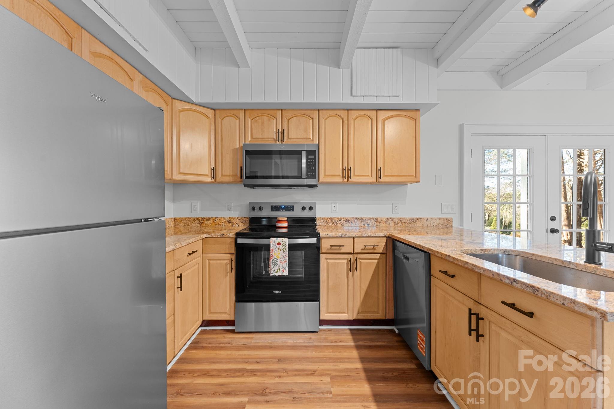 15 Glory Road Franklin, NC 28734 - Photo 6 of 37 a kitchen with stainless steel appliances a refrigerator sink and microwave