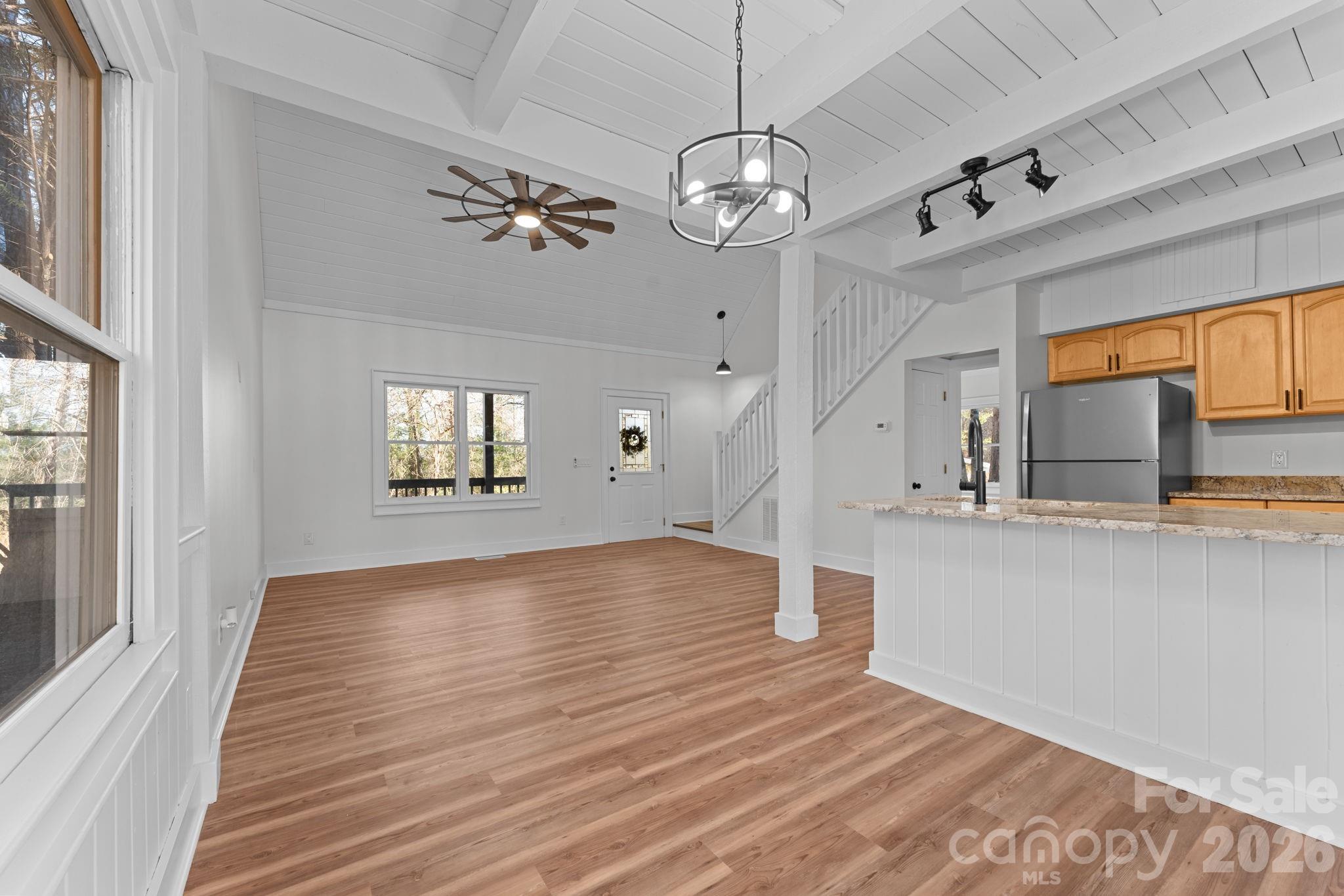 15 Glory Road Franklin, NC 28734 - Photo 7 of 37 a view of a livingroom with wooden floor and staircase