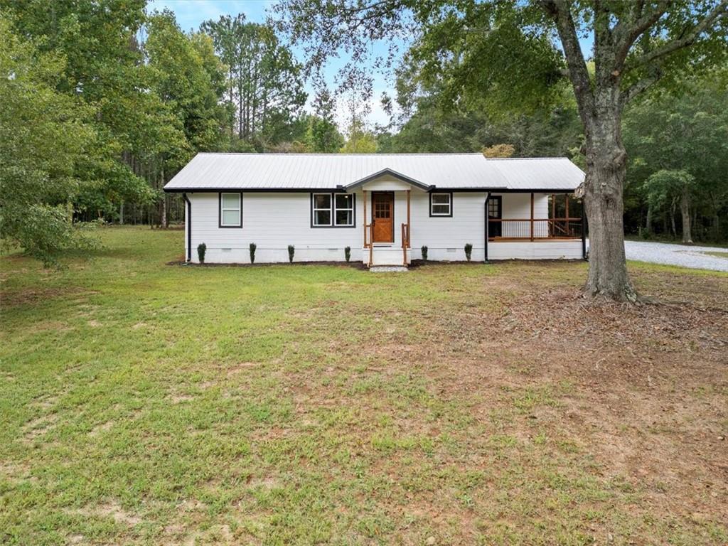4755 Sewell Road Cumming, GA 30028 - Photo 1 of 1 a front view of a house with a yard