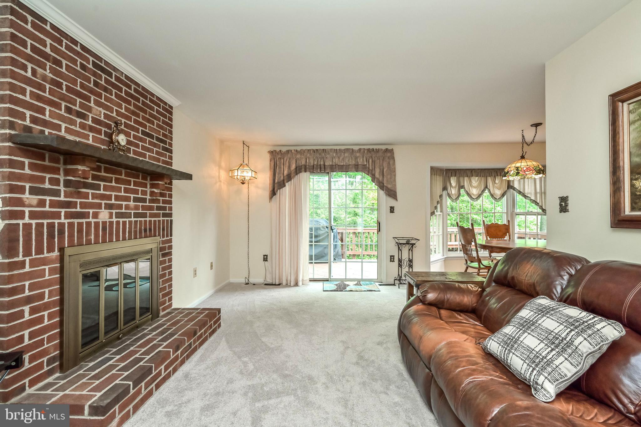 9754 Ironmaster Drive Burke, VA 22015 - Photo 11 of 34 Wood burning fireplace & walkout to deck