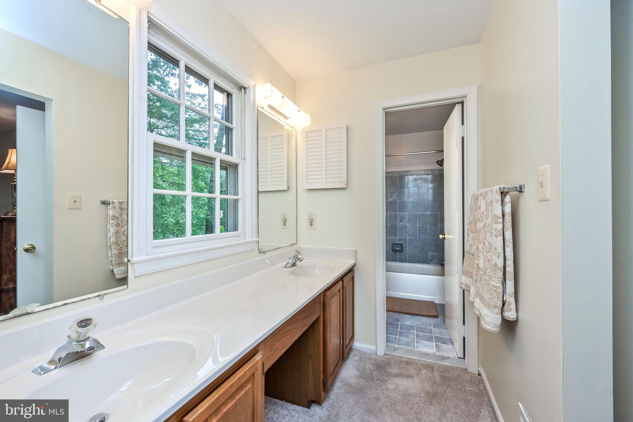 9754 Ironmaster Drive Burke, VA 22015 - Photo 14 of 34 Master bath with large walk-in closet