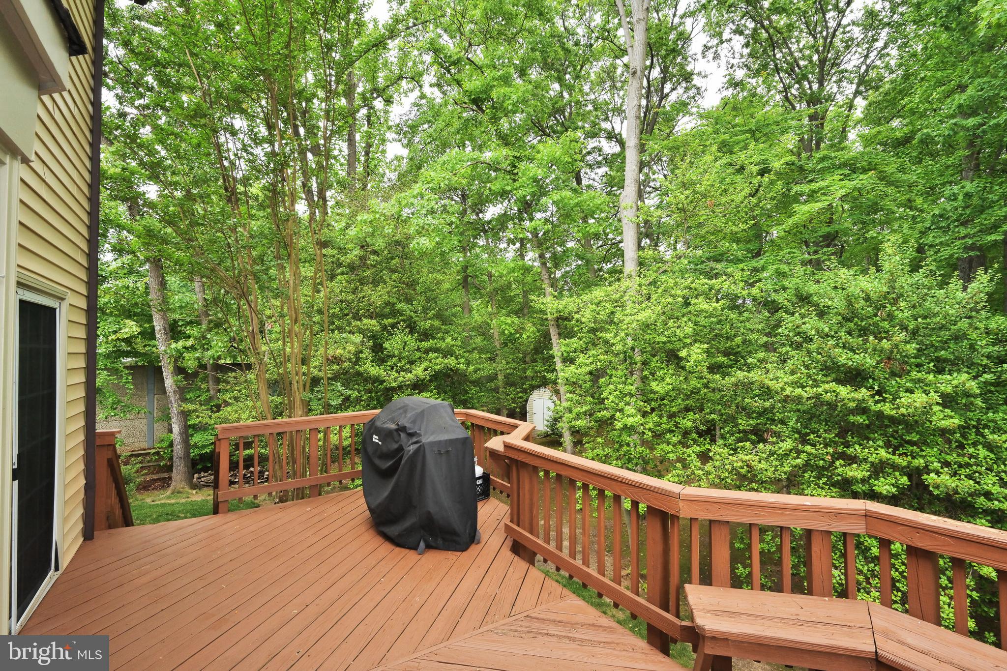 9754 Ironmaster Drive Burke, VA 22015 - Photo 26 of 34 Deck overlooks mature trees & landscaping
