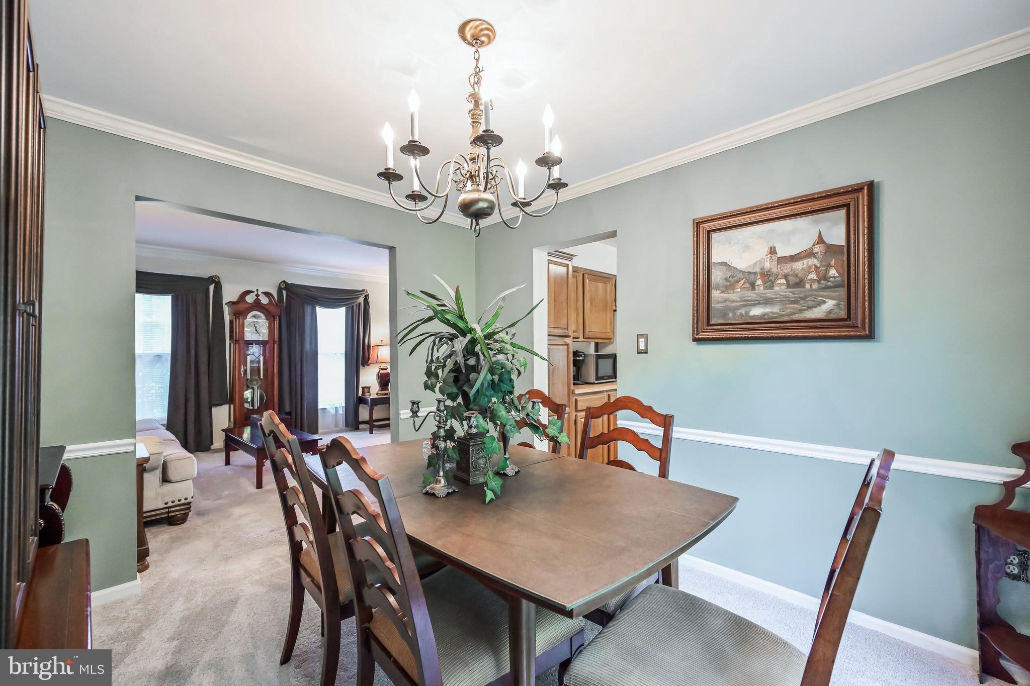 9754 Ironmaster Drive Burke, VA 22015 - Photo 6 of 34 Formal dining room w/crown molding & chair railing