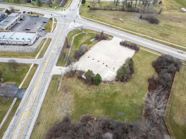 a view of a swimming pool with a yard