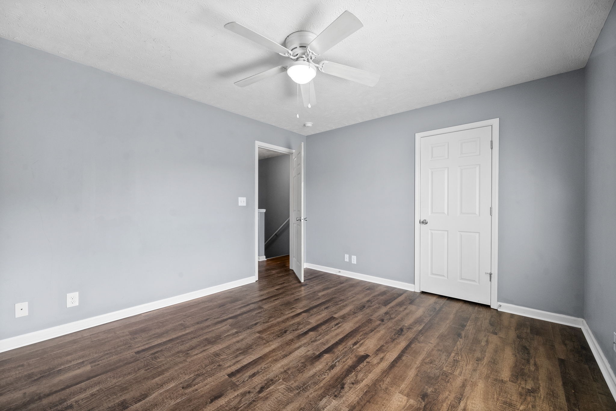249 Executive Avenue, Unit B Clarksville, TN 37042 - Photo 10 of 13 a view of an empty room with wooden floor