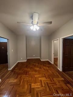 a view of a big room with closet and a ceiling fan