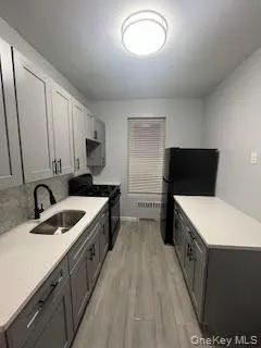 a kitchen with a cabinets and white appliances